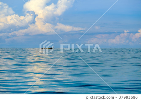 Fishermen sail their longtail boats out to sea Fishermen sail their longtail boats out to sea 37993686