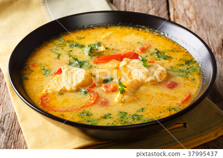 Moqueca stew fish with bell peppers in spicy 37995437