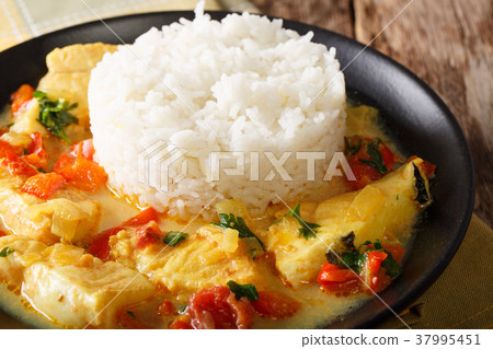 Fish stew in coconut milk with vegetables 37995451