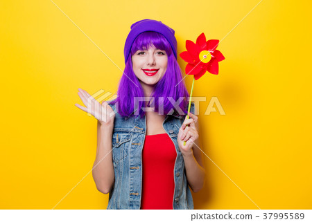 hipster girl with purple hairstyle with pinwheel 37995589