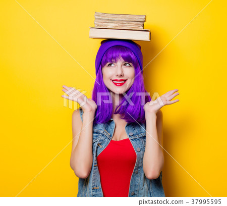 hipster girl with purple hairstyle with books 37995595