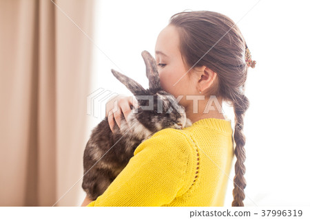 Girl with her favorite pet 37996319