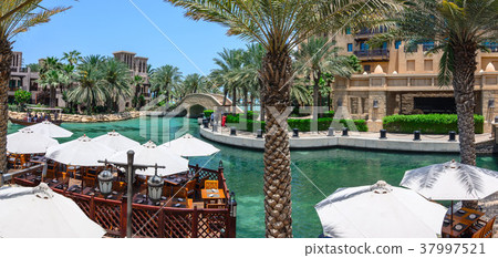DUBAI, UAE - OCTOBER 06, 2016: Waterfront villas DUBAI, UAE - OCTOBER 06, 2016: Waterfront villas 37997521