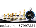 Chess and navigation compass on chessboard in conc 37997884