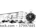 Chess and navigation compass on chessboard in conc 37997885