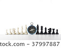 Chess and navigation compass on chessboard in conc 37997887