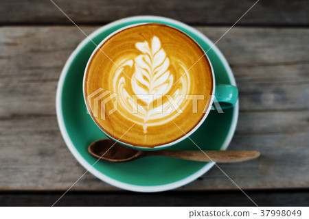 Cappuccino coffee in a green cup Cappuccino coffee in a green cup 37998049