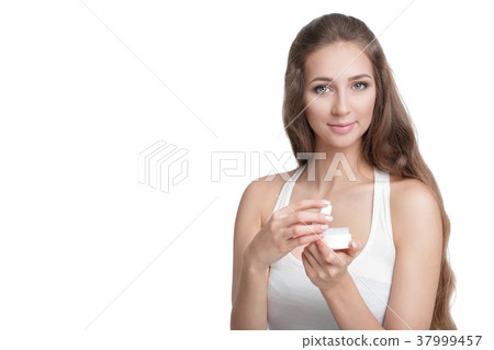 woman holding jar of cream woman holding jar of cream 37999457