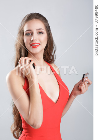 woman in red dress with perfume woman in red dress with perfume 37999480