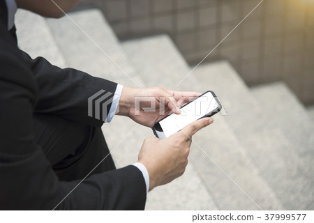 businessman using mobile phone. white screen. businessman using mobile phone. white screen. 37999577