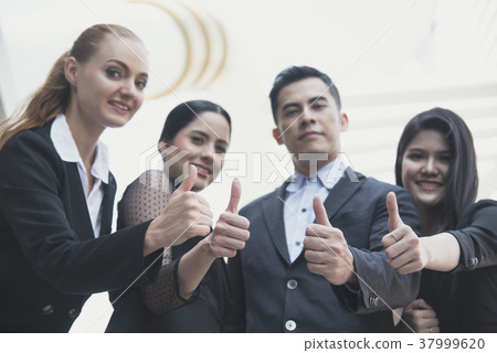 young people thumbs up together. concept teamwork young people thumbs up together. concept teamwork 37999620