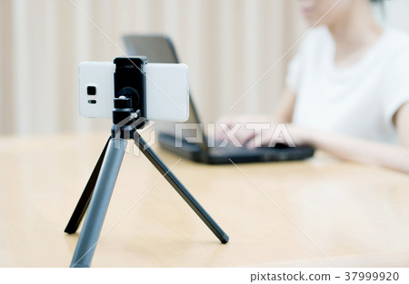 Woman vlogger looking using laptop computer  37999920