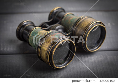 Old binoculars covered with patina. 38000408