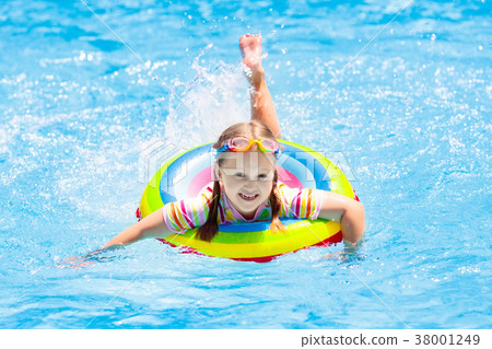 Child in swimming pool. Kids swim. Water play. 38001249