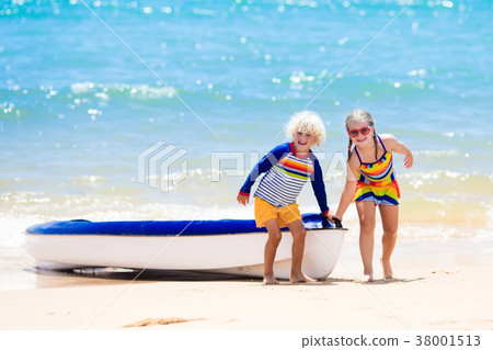 Kids kayaking in ocean. Children in kayak in sea 38001513