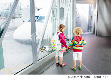 Kids travel and fly. Child at airplane in airport 38001515