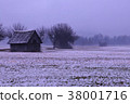 two small barns on a misty raining day	 38001716