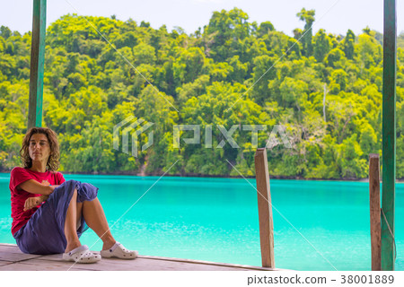Woman relaxing in tourist resort 38001889