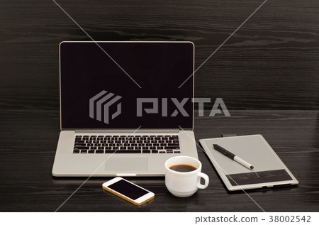 Open notebook, graphics tablet, coffee cup Open notebook, graphics tablet, coffee cup 38002542