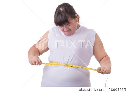 Fat Asian woman wear white t-shirt and checking her body size with measurement tape isolated on white 38005315