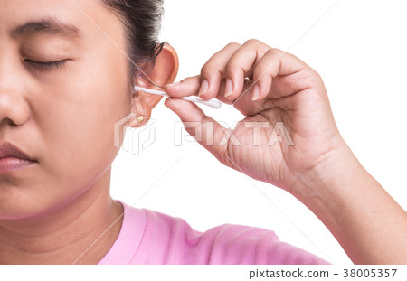 Woman cleaning her ear by using cotton bud stick isolated on white background Woman cleaning her ear by using cotton bud stick isolated on white background 38005357