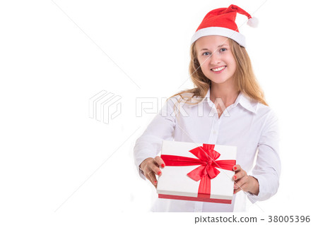 Beautiful caucasian businesswoman in white shirt. wearing red christmas hat and holding new year gift box. Studio shooting isolated on white Beautiful caucasian businesswoman in white shirt. wearing red christmas hat and holding new year gift box. Studio shooting isolated on white 38005396