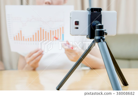 Businesswoman presenting financial stats Businesswoman presenting financial stats 38008682