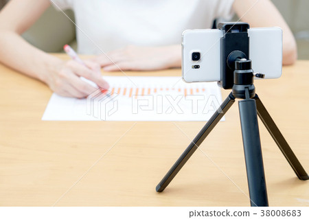 Businesswoman present financial stats on vlogging 38008683
