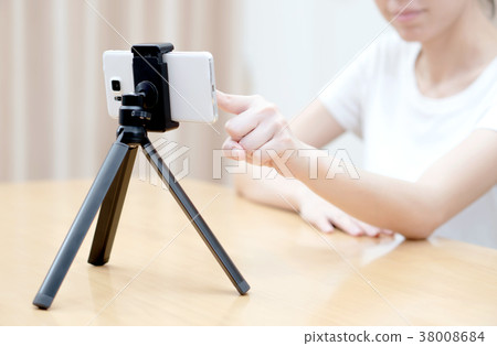 Young woman recording content for her blog Young woman recording content for her blog 38008684