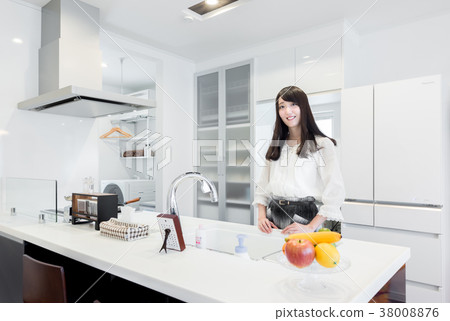 Housewife in the kitchen 38008876
