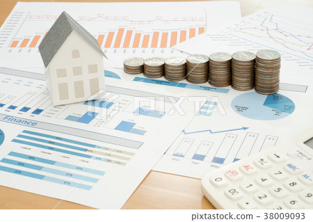 With House Model And Stack Of Coins On Desk With House Model And Stack Of Coins On Desk 38009093