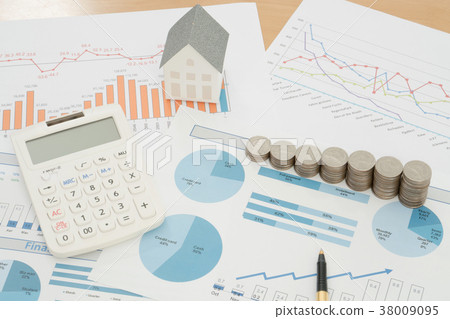 With House Model And Stack Of Coins On Desk With House Model And Stack Of Coins On Desk 38009095
