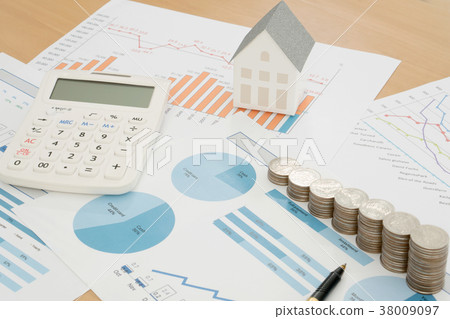 With House Model And Stack Of Coins On Desk 38009097