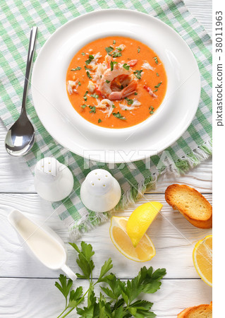 hot bisque in a white bowl hot bisque in a white bowl 38011963