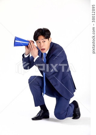 A young man in his twenties who communicates with the world. Loud loudspeaker A young man in his twenties who communicates with the world. Loud loudspeaker 38012895