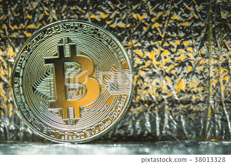 Silver Bitcoin on a structural background. Close 38013328