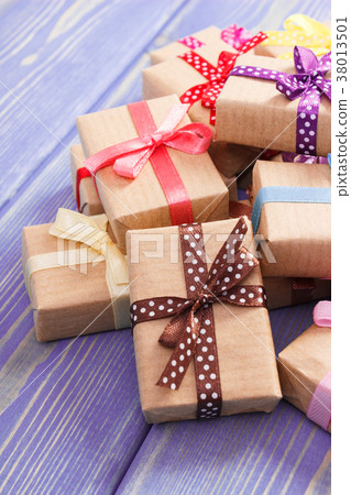 Wrapped gifts with colorful ribbons for Valentines 38013501
