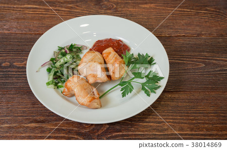 Roasted chicken breast fillet on a plate. Roasted chicken breast fillet on a plate. 38014869