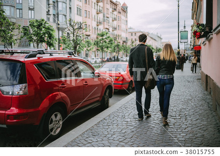 A pair of lovers walking A pair of lovers walking 38015755