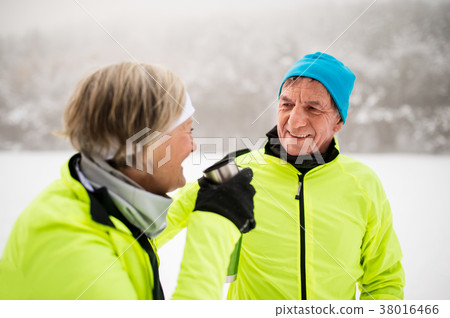 Senior couple cross-country skiing. Senior couple cross-country skiing. 38016466