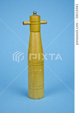 vintage wooden pepper grinder on blue background vintage wooden pepper grinder on blue background 38016981