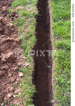 trench in summer farm yard trench in summer farm yard 38016982