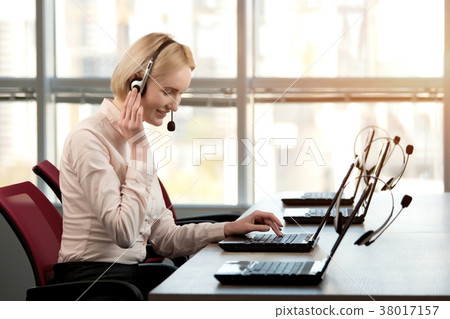 Side view woman wearing headset. 38017157