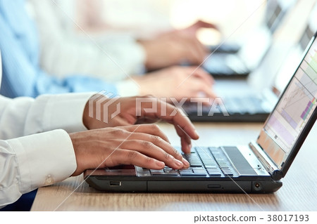 Black man's hands typing on laptop. Black man's hands typing on laptop. 38017193