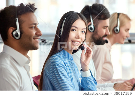 Korean girl in call center with colleagues. 38017199