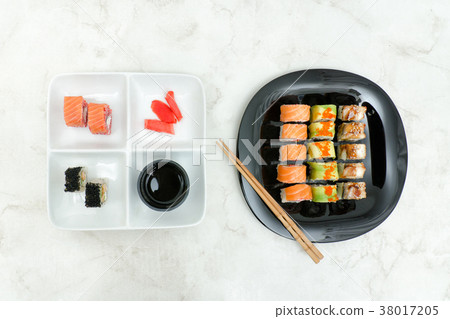 Black and white plate with various rolls Black and white plate with various rolls 38017205