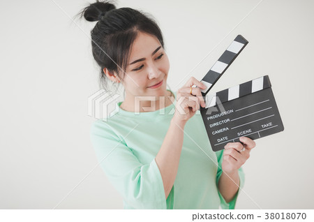 Young Asian woman playing clapperboard 38018070
