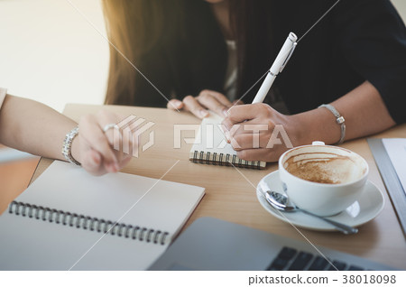 Two women participate business meeting 38018098