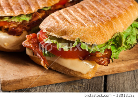 Toasted ciabatta sandwich with smoked bacon Toasted ciabatta sandwich with smoked bacon 38018152