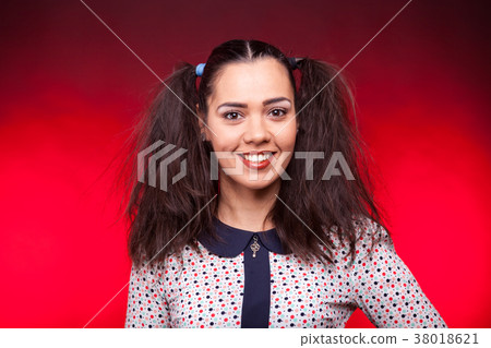 Smiling happy woman lookign at the camera Smiling happy woman lookign at the camera 38018621